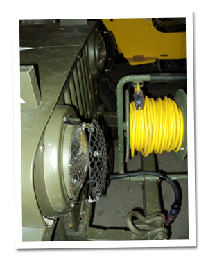 Extension cord spool mounted on front bumper Extension cord spool mounted on front bumper